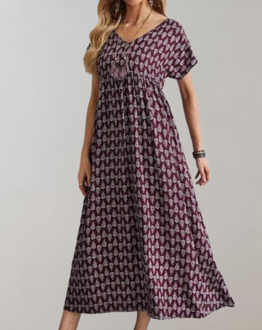 Anna - Een op vintage geïnspireerde lange jurk met een losse pasvorm, korte mouwen en een v-halslijn.