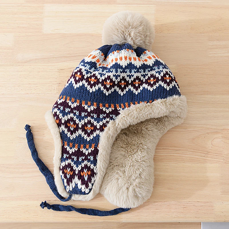 Sidney - SiberianSnug Gebreide muts met imitatiebontvoering en toef voor winterse warmte